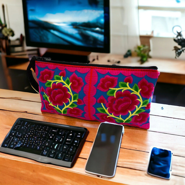 Ruby rose baby blossom on marine blue wristlet