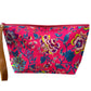 Multi blue florals on neon pink clutch