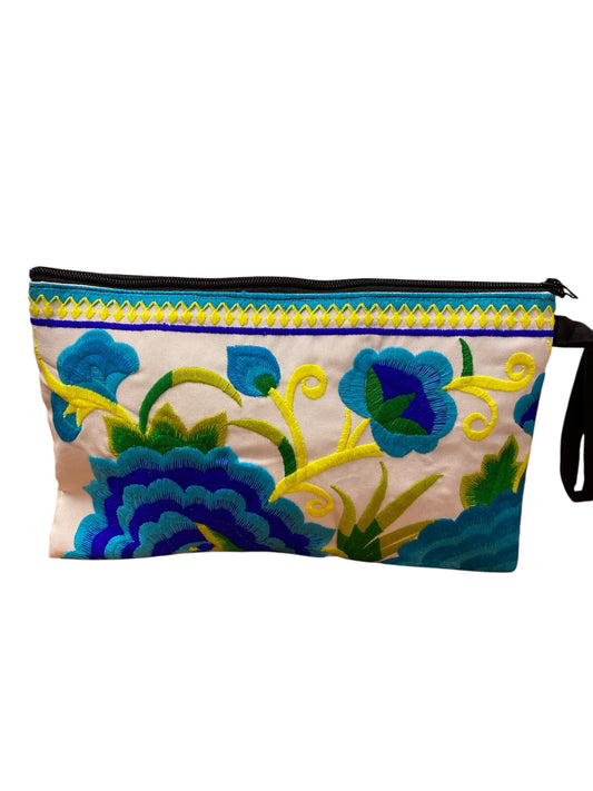 Aquamarine and cobalt blue bloom on white blue clutch