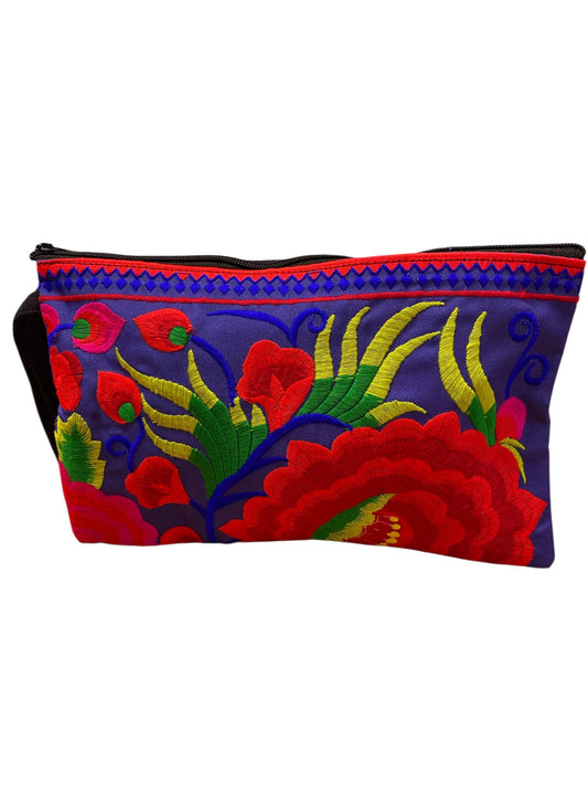 Ruby red bloom on electric blue clutch
