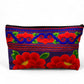 Ruby red poppy on electric blue clutch