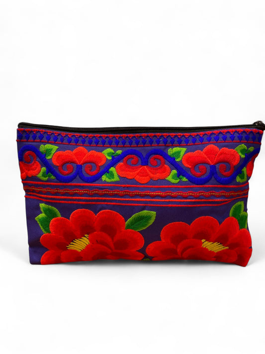 Ruby red poppy on electric blue clutch